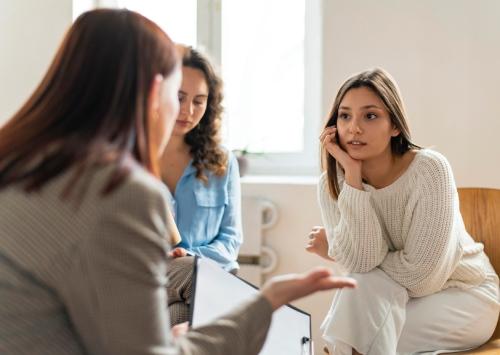 Two women talking with a counsellor